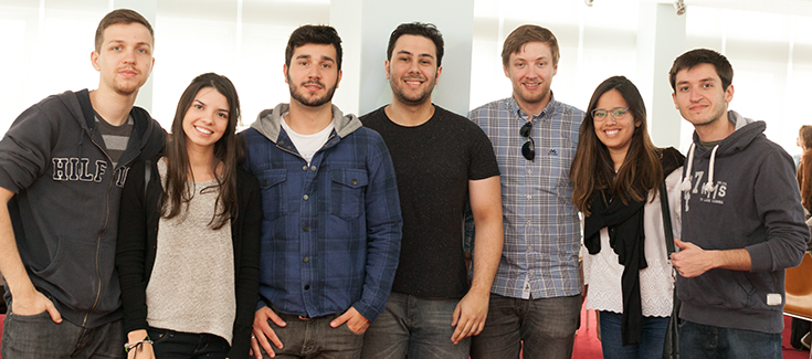 photo of 7 young people smiling to the camera 